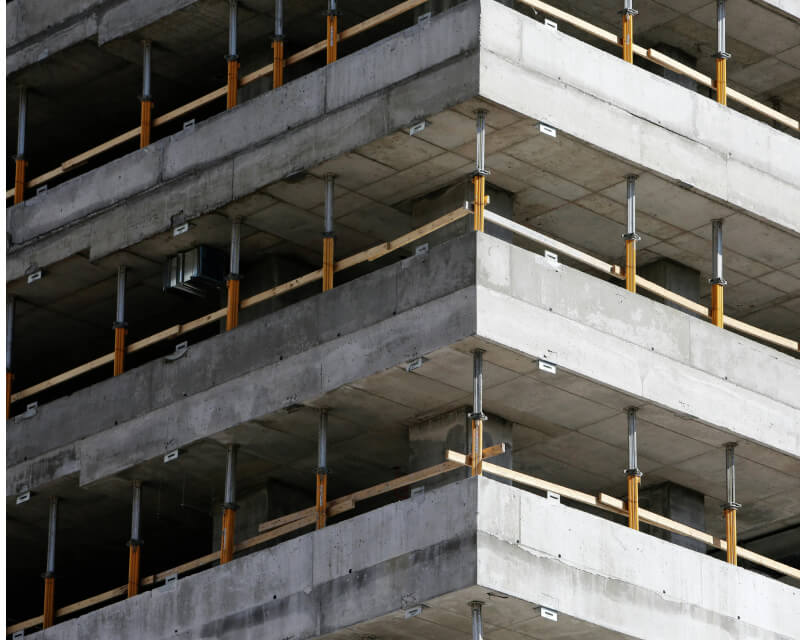 A three story building under construction.