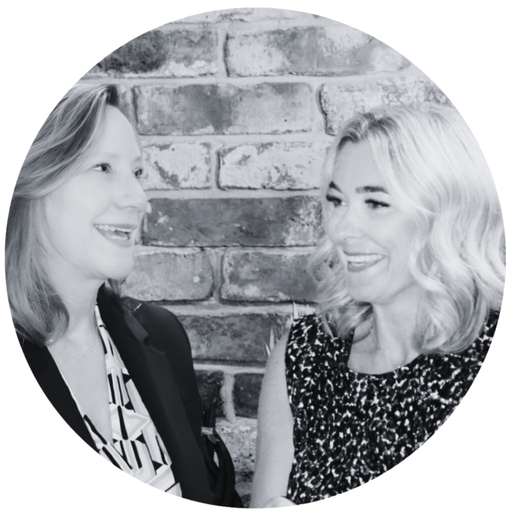 Two coworkers laughing together.